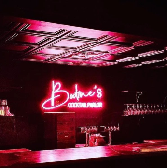 neon sign for bars and restaurants